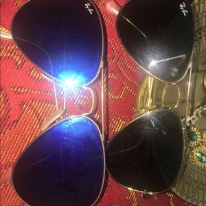 Two aviator ray bans sunglasses.